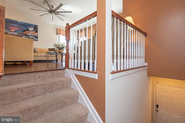 an aerial view of a house with a garden and lake view