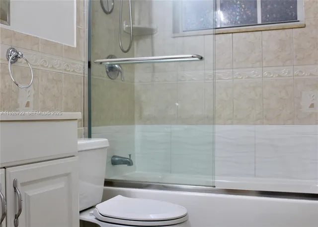 a view of a hallway with closet and a hallway