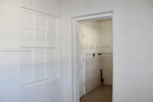 a backyard of a house with a garden and plants