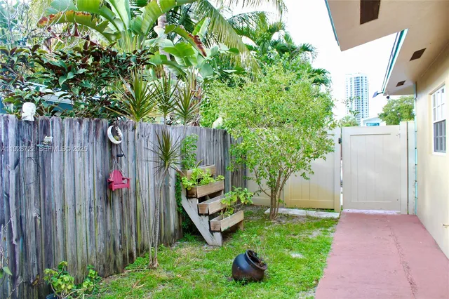 a view of a backyard with plants