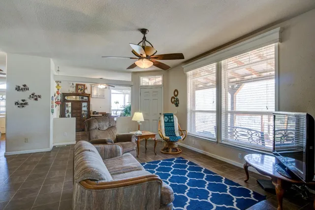 a kitchen with granite countertop stainless steel appliances a sink stove and refrigerator