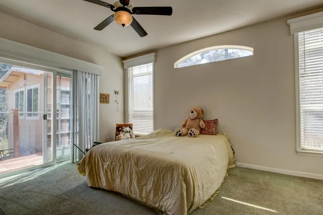 a bathroom with a sink a mirror and a window
