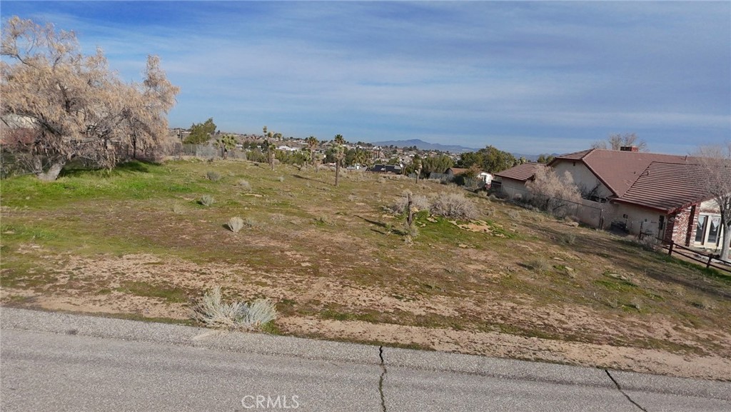0 Yuba Street Hesperia, CA 92345 - Photo 2 of 6 a view of a dry yard with wooden fence