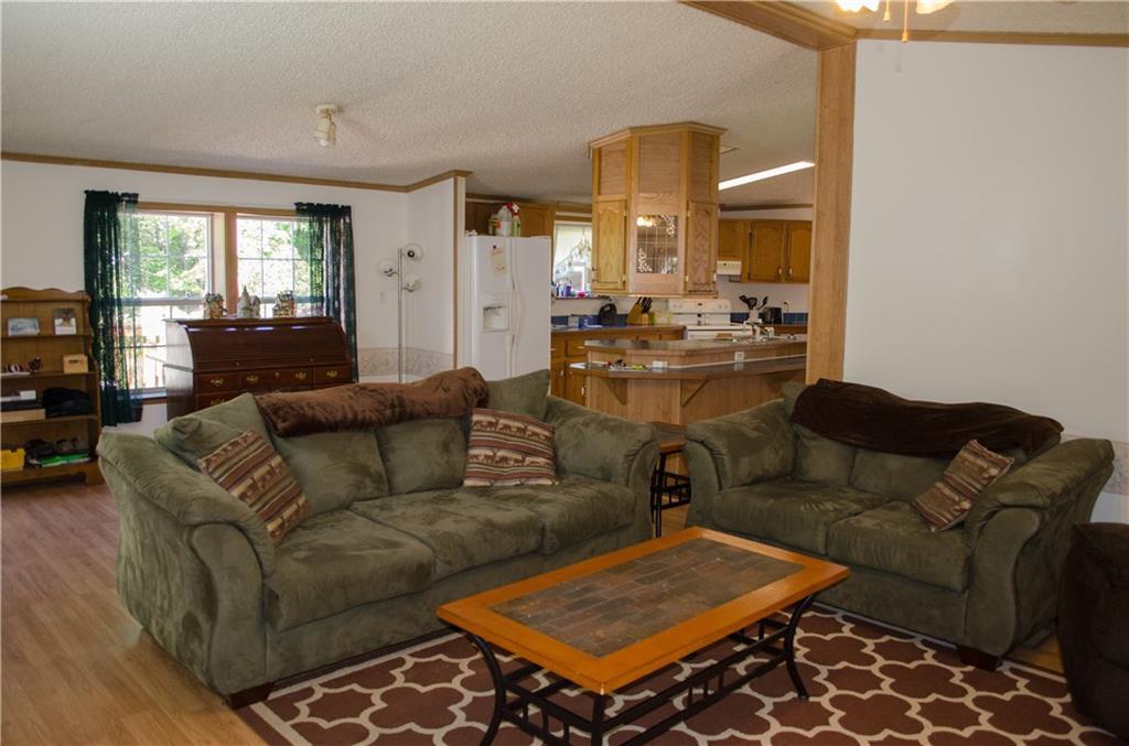 2401 Hudson Road Hudson, ME 04449 - Photo 7 of 26 Living room is open to kitchen