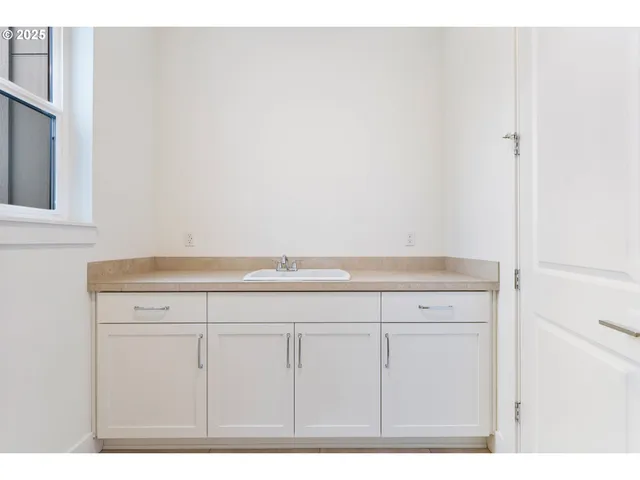 a view of an empty room with windows