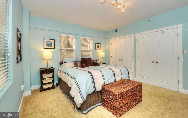 1727 R Street Northwest, Unit 104 Washington, DC 20009 - Photo 14 of 14 a bedroom with a bed lamp closet and window
