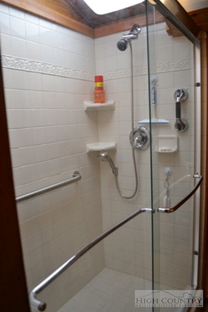 174 Deer Run Road Deep Gap, NC 28618 - Photo 14 of 35 a bathroom with a shower
