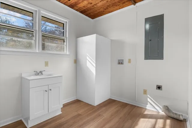 a white toilet sitting next to a bathroom sink
