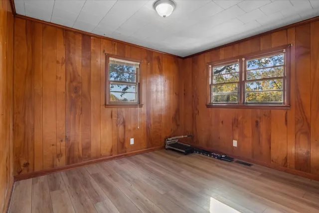 a view of a house with a tree