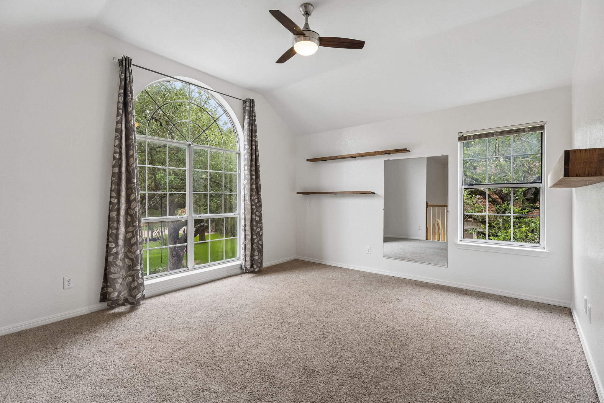 10400 O'Rourk Lane Austin, TX 78739 - Photo 17 of 33 an empty room with windows