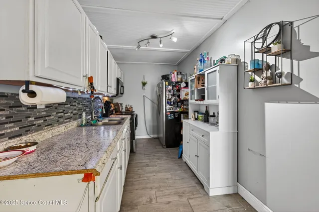 a backyard of a building with lots of green space