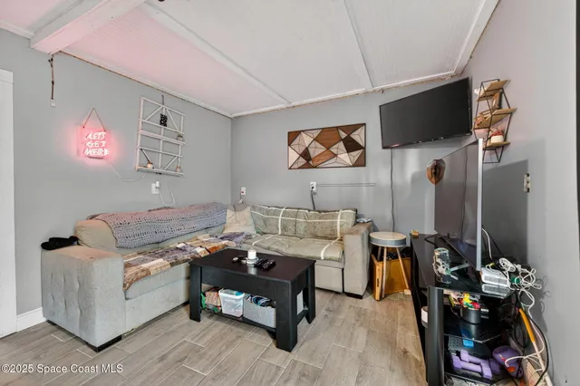 a view of a house with swimming pool and sitting area