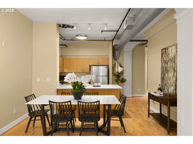 a view of a dining room with furniture and wooden floor