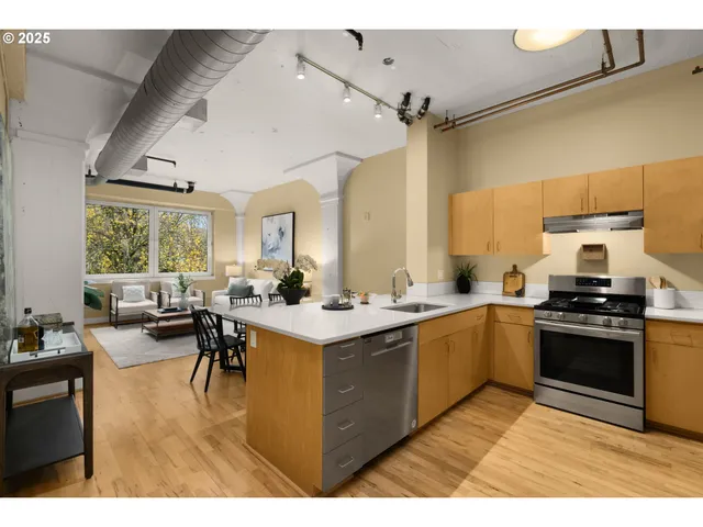 a kitchen with a sink appliances and cabinets