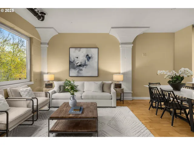 a living room with furniture and a large window