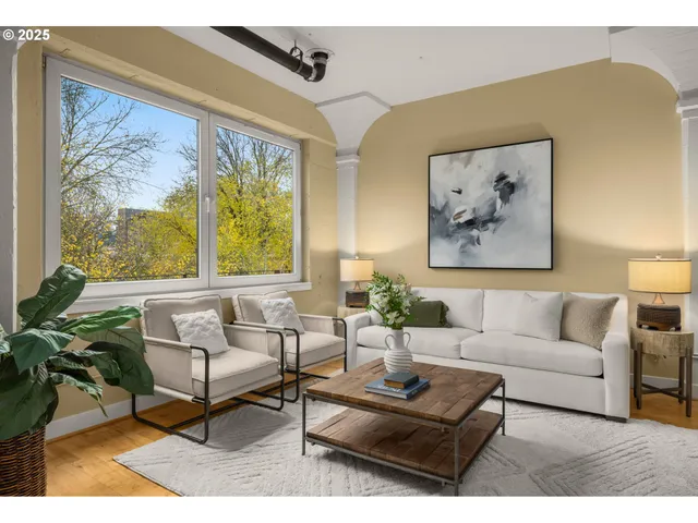 a living room with furniture and a large window