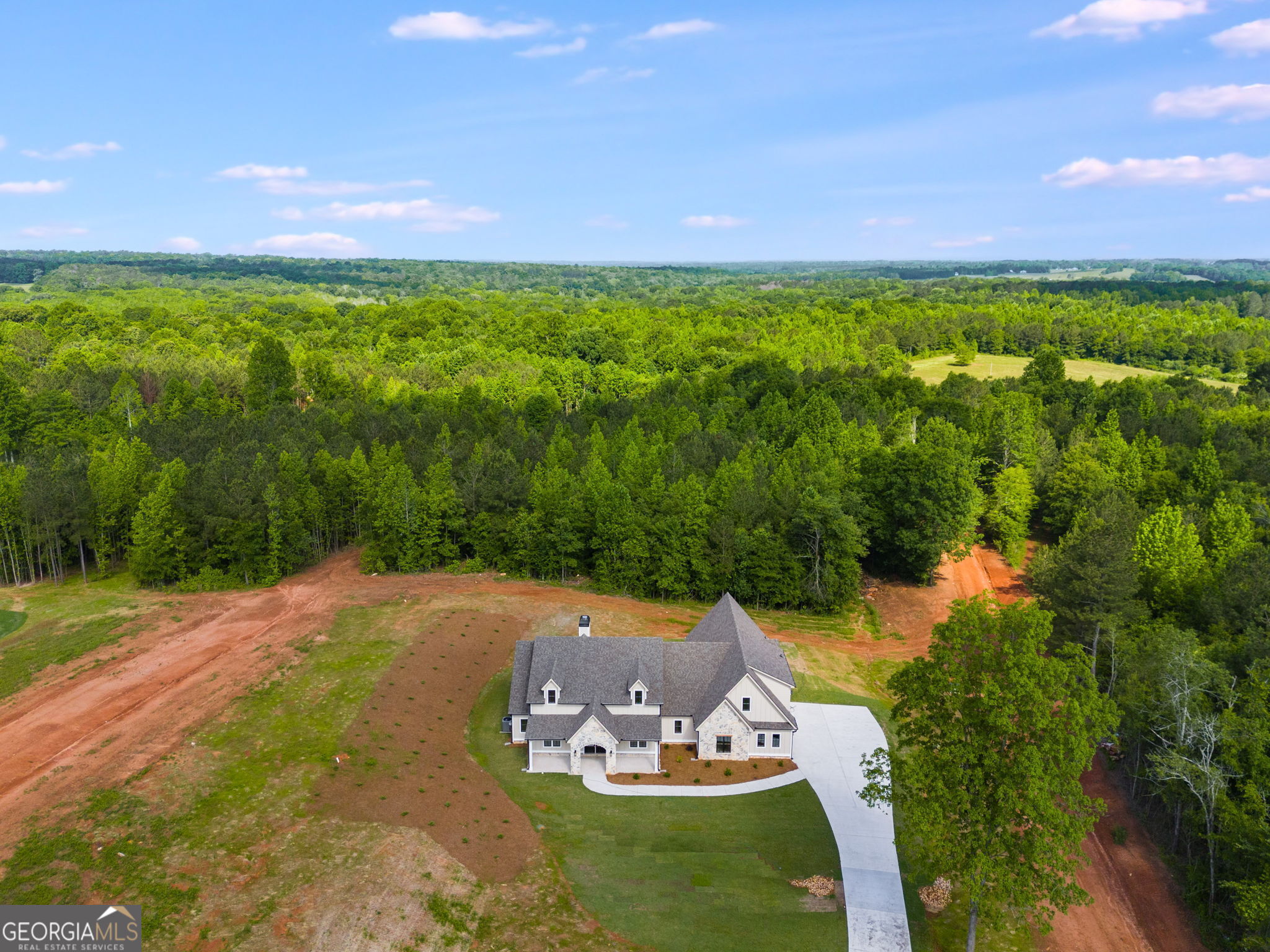 1575 Bethesda Church Road Carrollton, GA 30117 - Photo 2 of 46 a view of a lake with a field