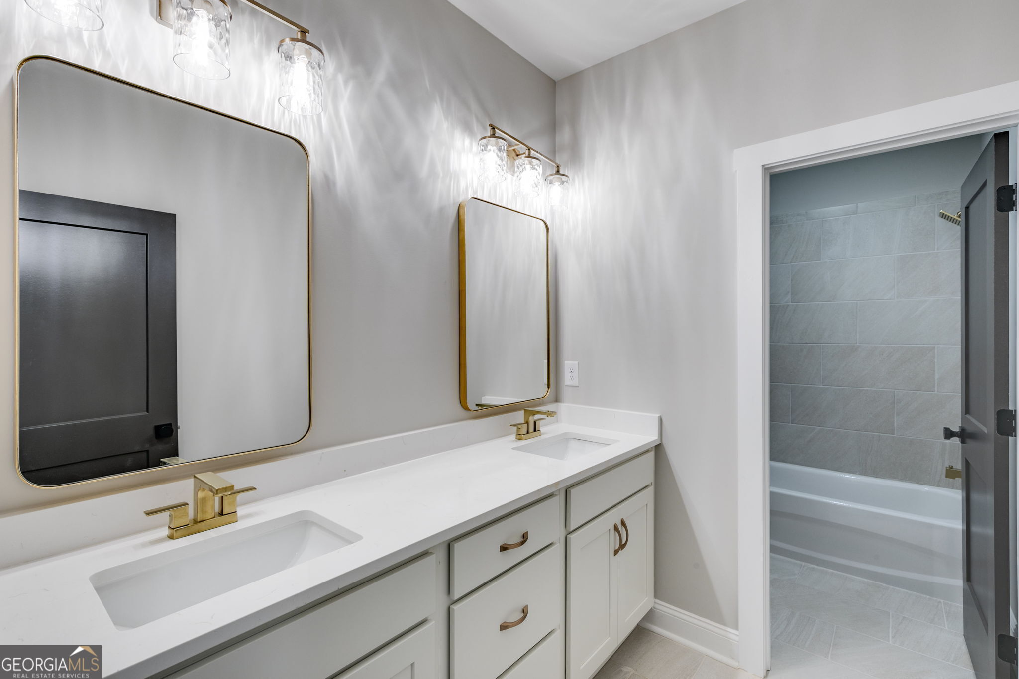 1575 Bethesda Church Road Carrollton, GA 30117 - Photo 24 of 46 a bathroom with a double vanity sink and a mirror