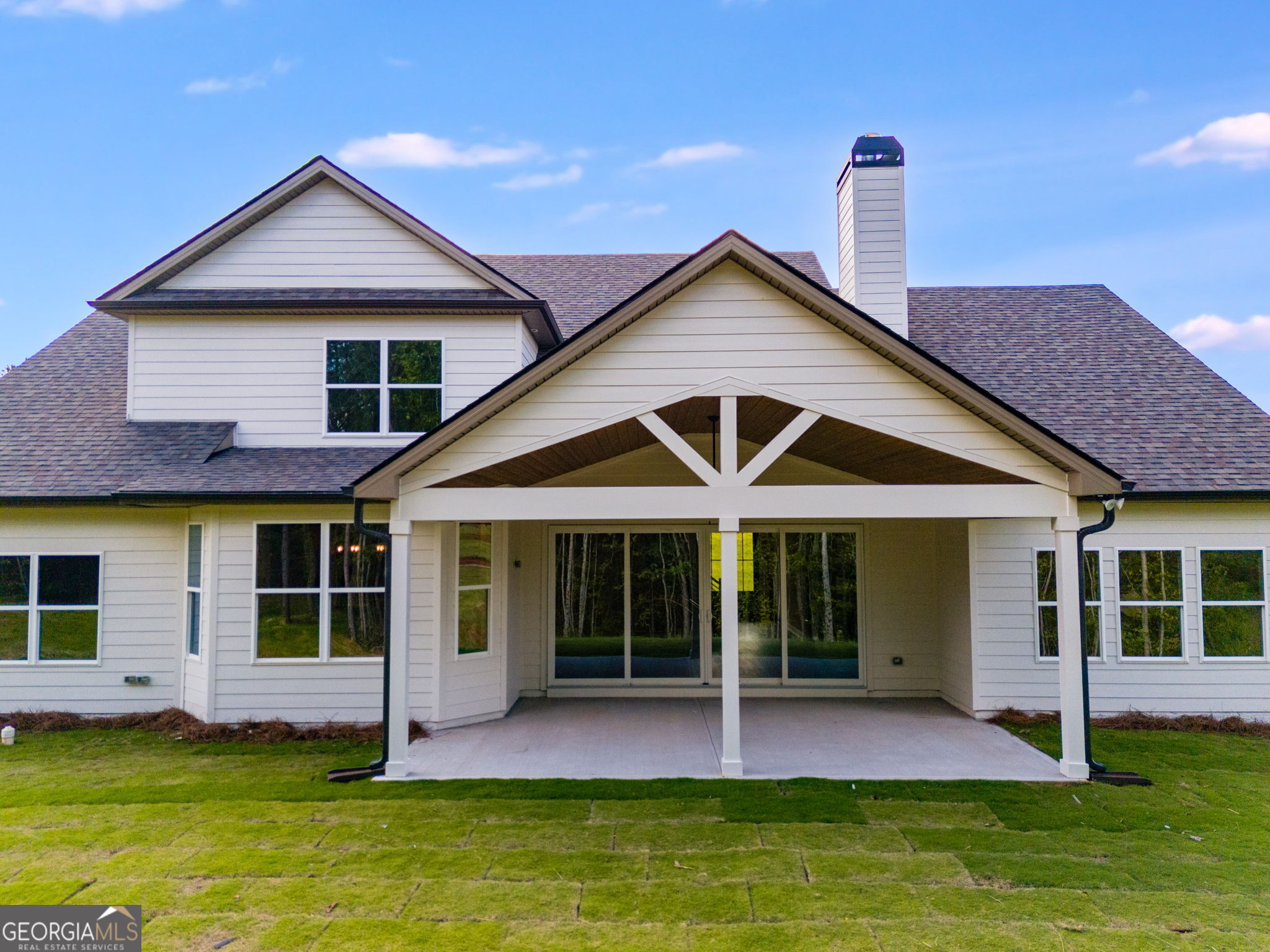 1575 Bethesda Church Road Carrollton, GA 30117 - Photo 41 of 46 a front view of a house with a yard table and chairs
