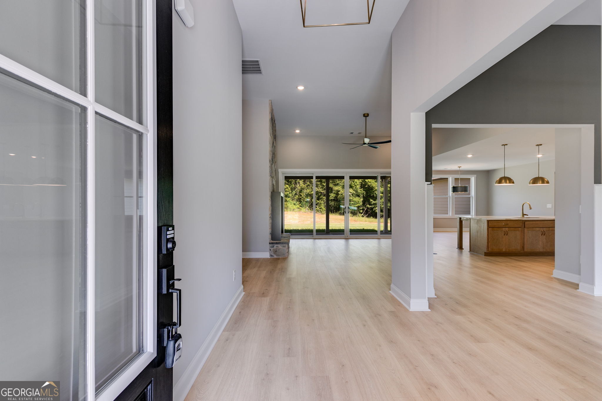 1575 Bethesda Church Road Carrollton, GA 30117 - Photo 7 of 46 a view of a hallway view with wooden floor and a living room