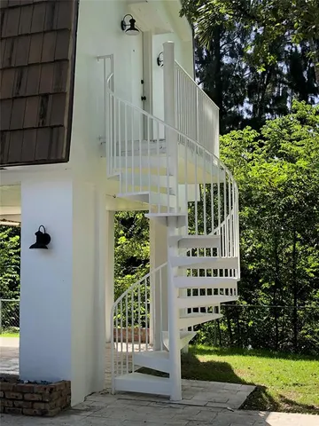 a view of a wooden door with a house