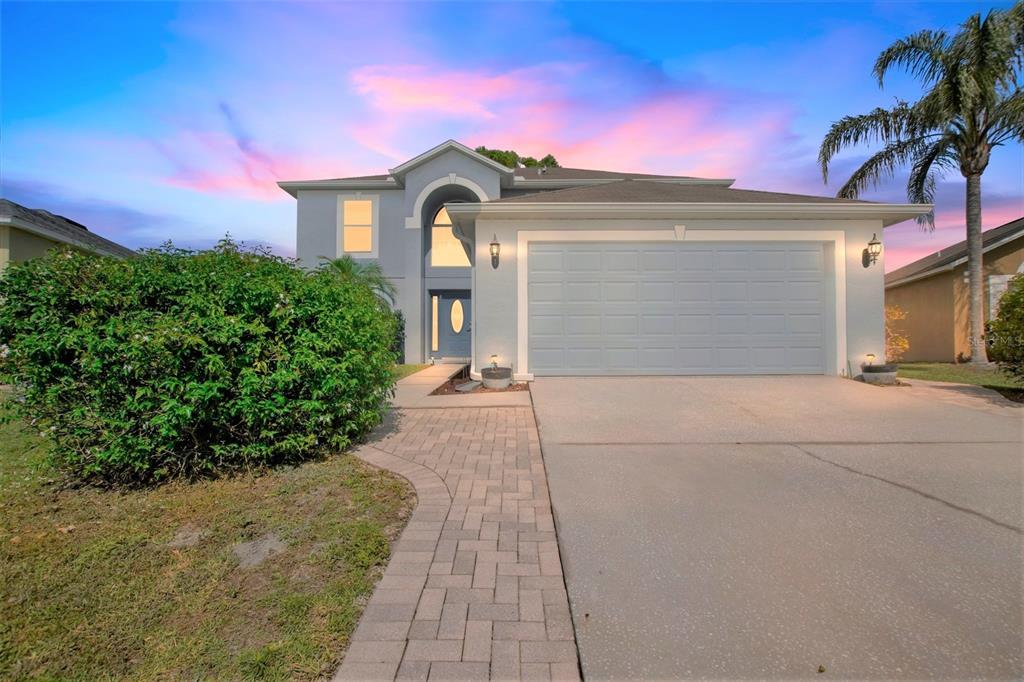 24825 Ravello Street Land O Lakes, FL 34639 - Photo 1 of 1 a front view of a house with a yard