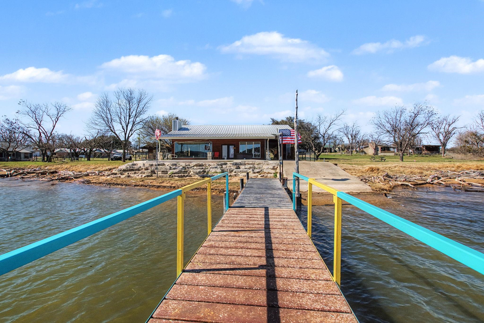 303 Lakeshore Loop Tow, TX 78672 - Photo 11 of 30 a view of swimming pool with outdoor seating