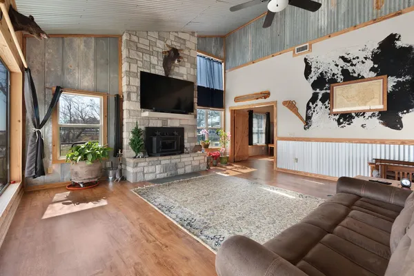 a living room with lots of furniture and a chandelier