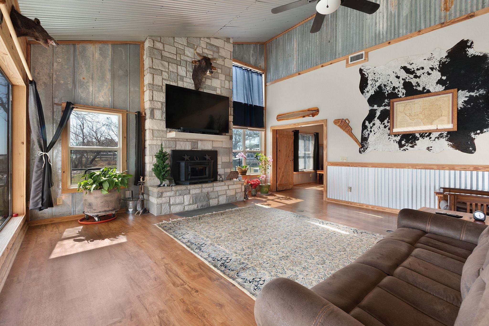 303 Lakeshore Loop Tow, TX 78672 - Photo 17 of 30 a living room with furniture and a flat screen tv