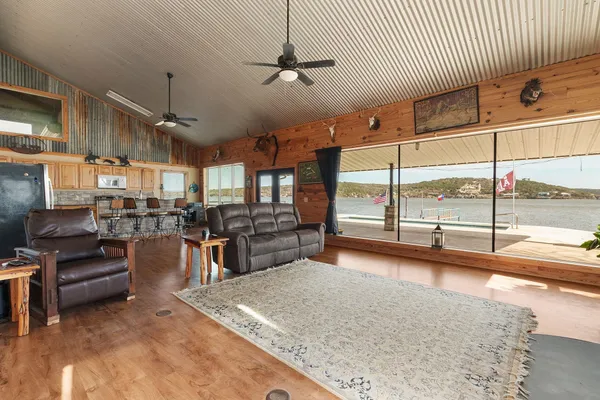 a spacious bedroom with a bed and a chandelier