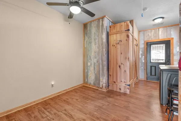 a bathroom with a granite countertop toilet sink and mirror