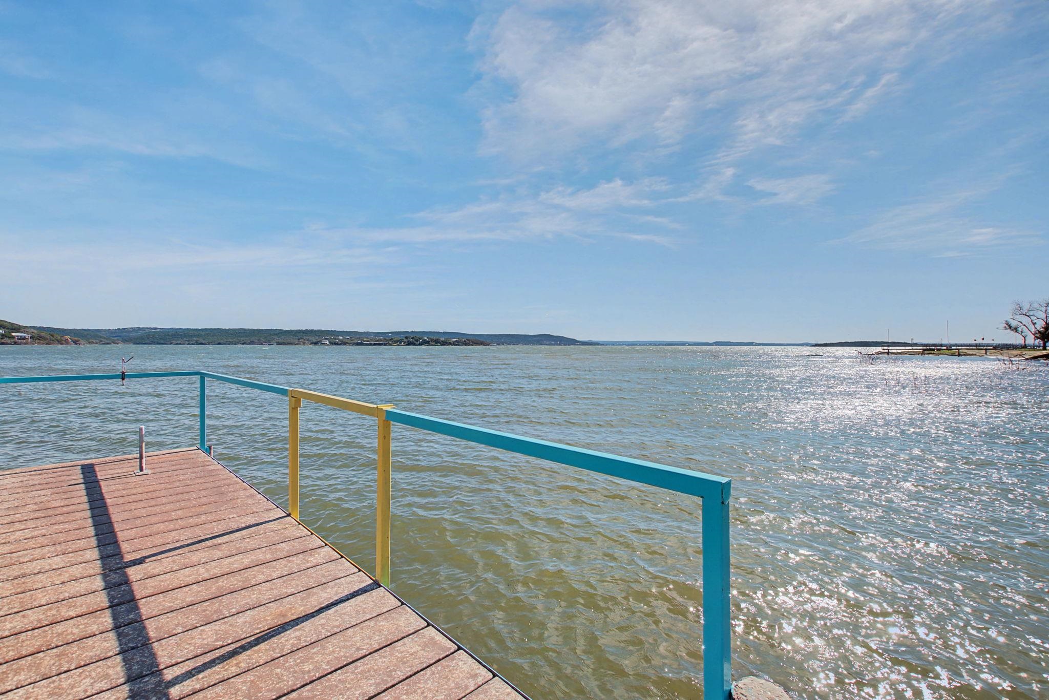303 Lakeshore Loop Tow, TX 78672 - Photo 10 of 30 a view of deck with ocean and mountain in the back
