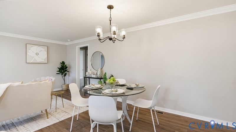 25209 Ritchie Avenue Petersburg, VA 23803 - Photo 39 of 50 a view of a dining room with furniture wooden floor and a chandelier