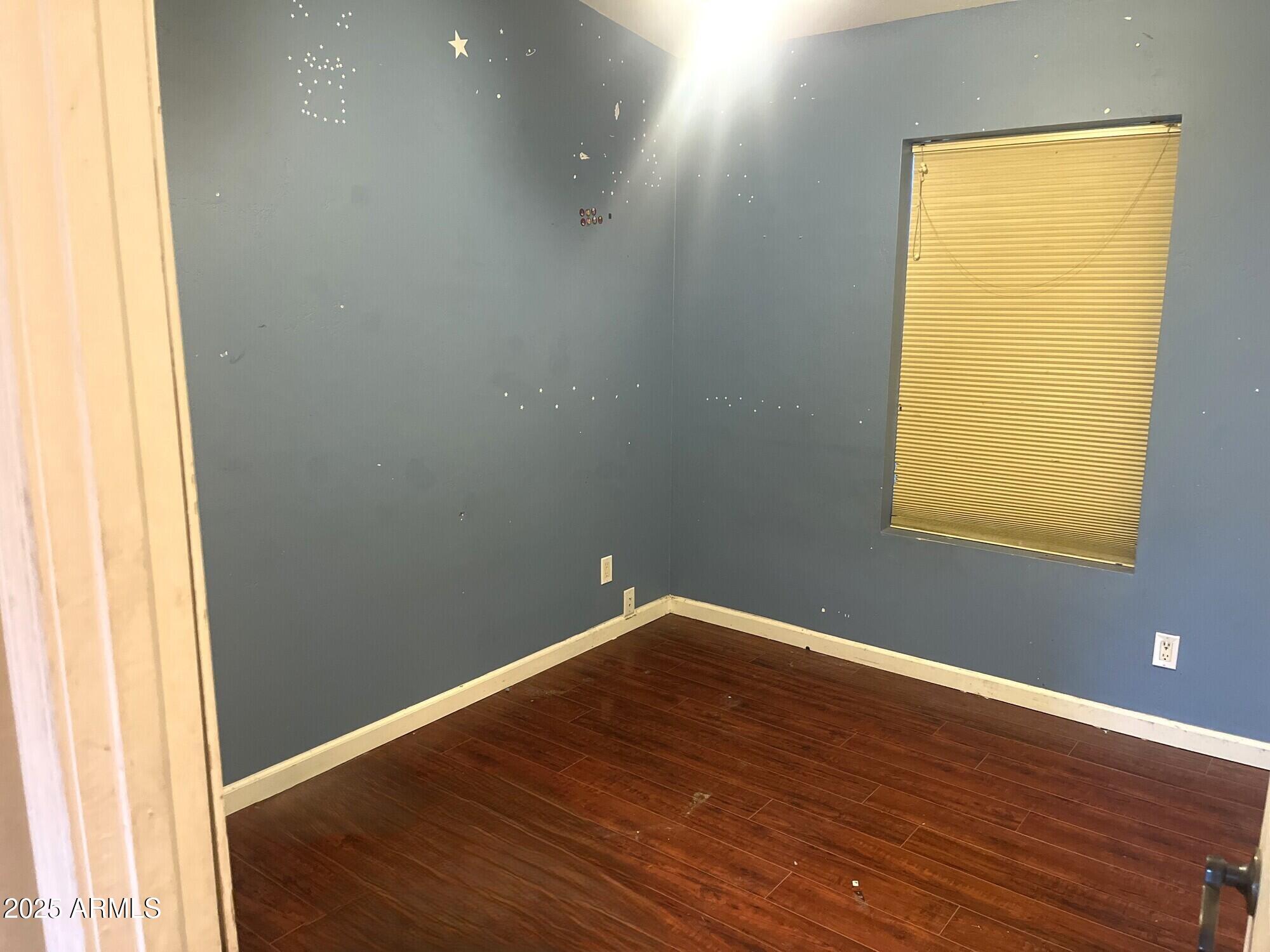 2322 Beasley Flat Road Camp Verde, AZ 86322 - Photo 13 of 27 an empty room with wooden floor and a window