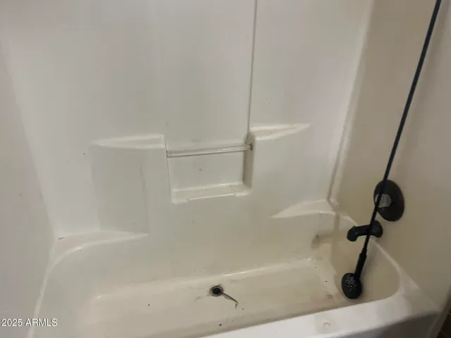 a close view of a bathtub in bathroom