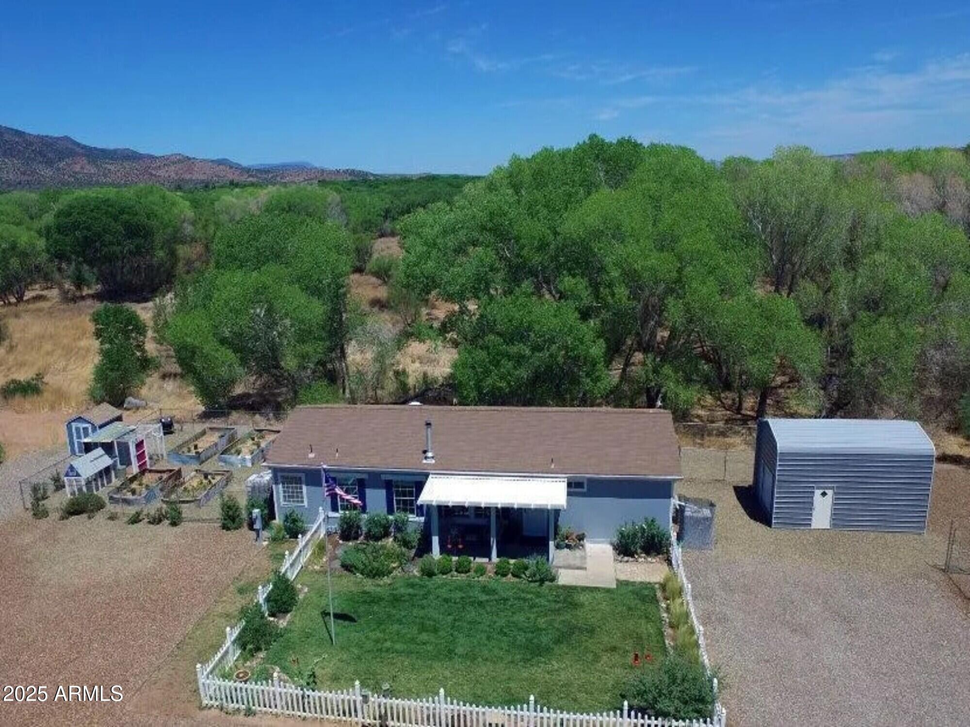 2322 Beasley Flat Road Camp Verde, AZ 86322 - Photo 3 of 27 an aerial view of a house with a yard