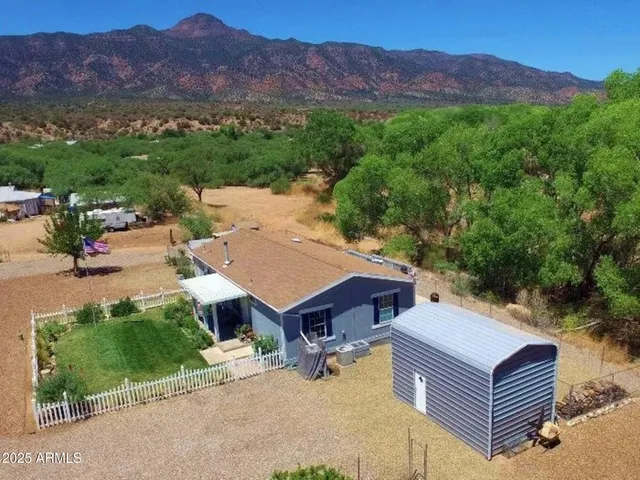 an aerial view of a house with a garden