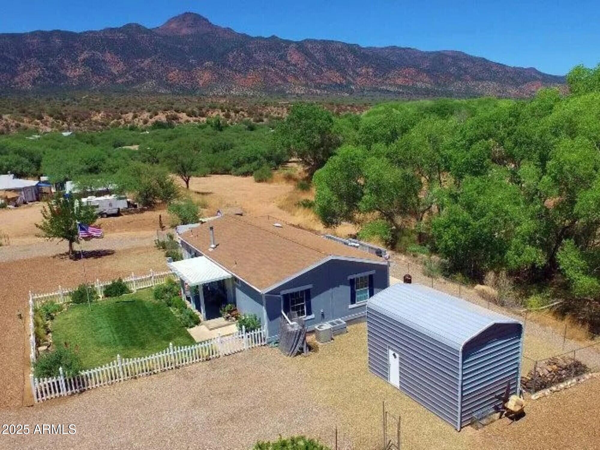2322 Beasley Flat Road Camp Verde, AZ 86322 - Photo 4 of 27 an aerial view of a house with a garden