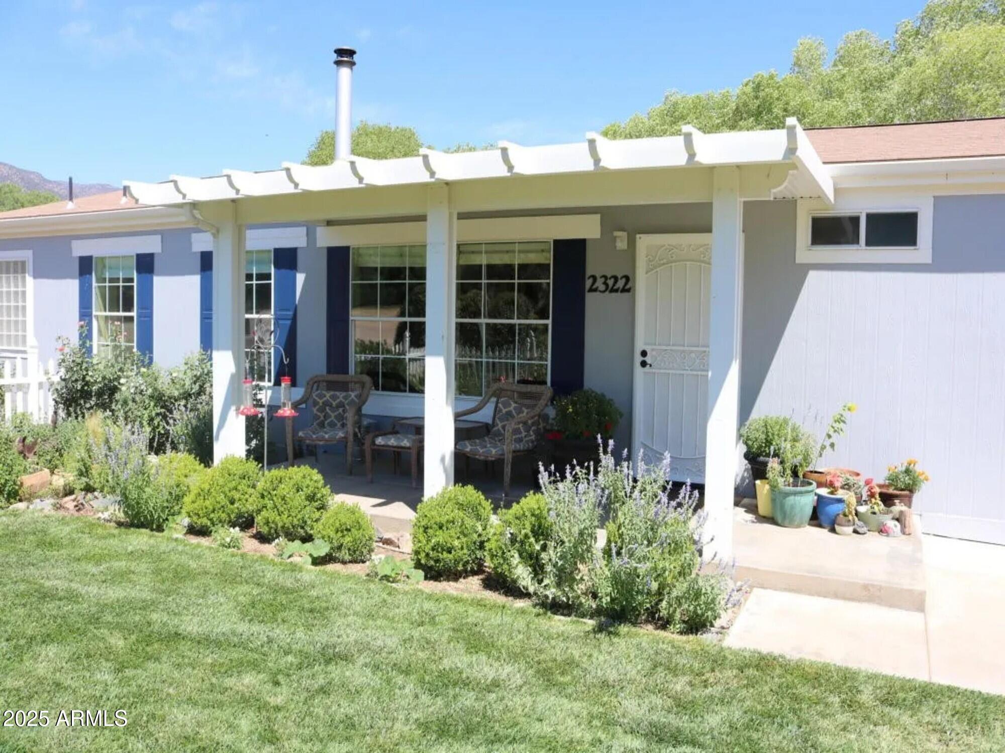 2322 Beasley Flat Road Camp Verde, AZ 86322 - Photo 5 of 27 a front view of a house with a yard