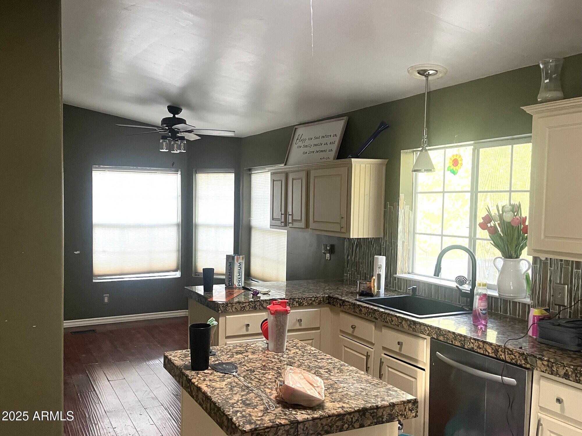 2322 Beasley Flat Road Camp Verde, AZ 86322 - Photo 9 of 27 a kitchen with stainless steel appliances granite countertop sink stove and cabinets