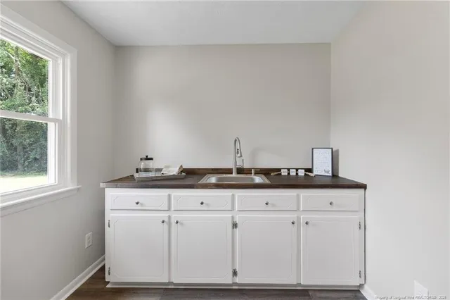a view of cabinets with wooden floor