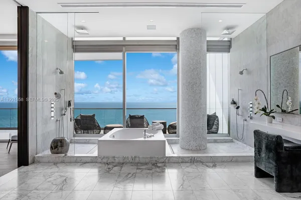 a large bathroom with a tub and sink