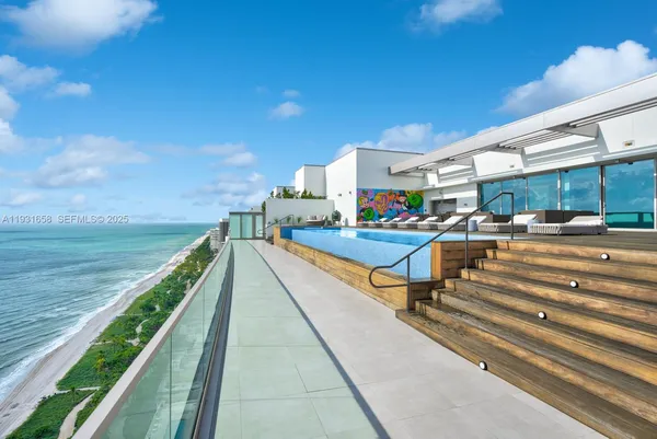 a view of a backyard with sitting area