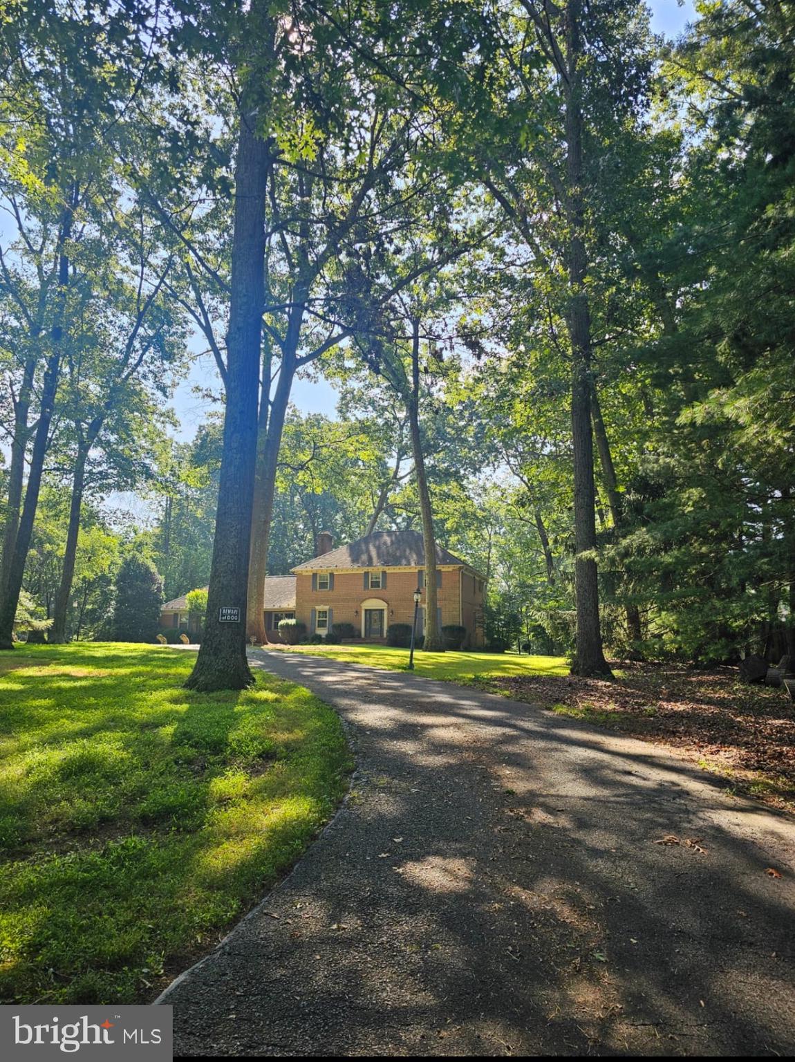 10947 Lawyers Road Reston, VA 20191 - Photo 2 of 3 a view of a road with a yard
