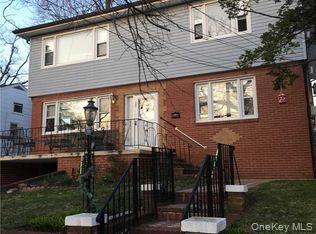 18 Juniper Road, Unit 2 Port Washington, NY 11050 - Photo 1 of 1 a view of a patio with table and chairs and potted plants