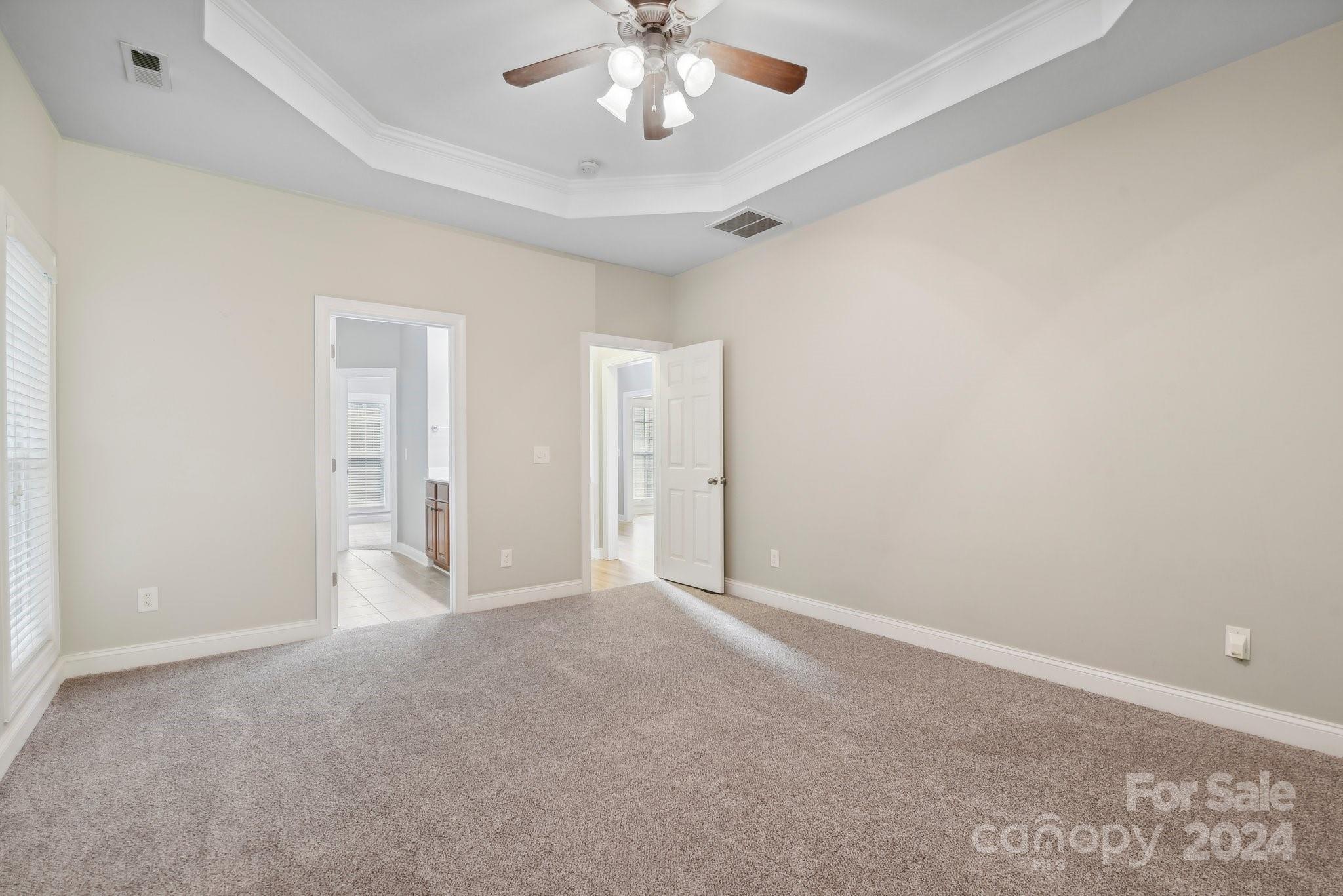 1013 Wesley Downs Road Monroe, NC 28110 - Photo 17 of 41 a view of an empty room with a chandelier fan