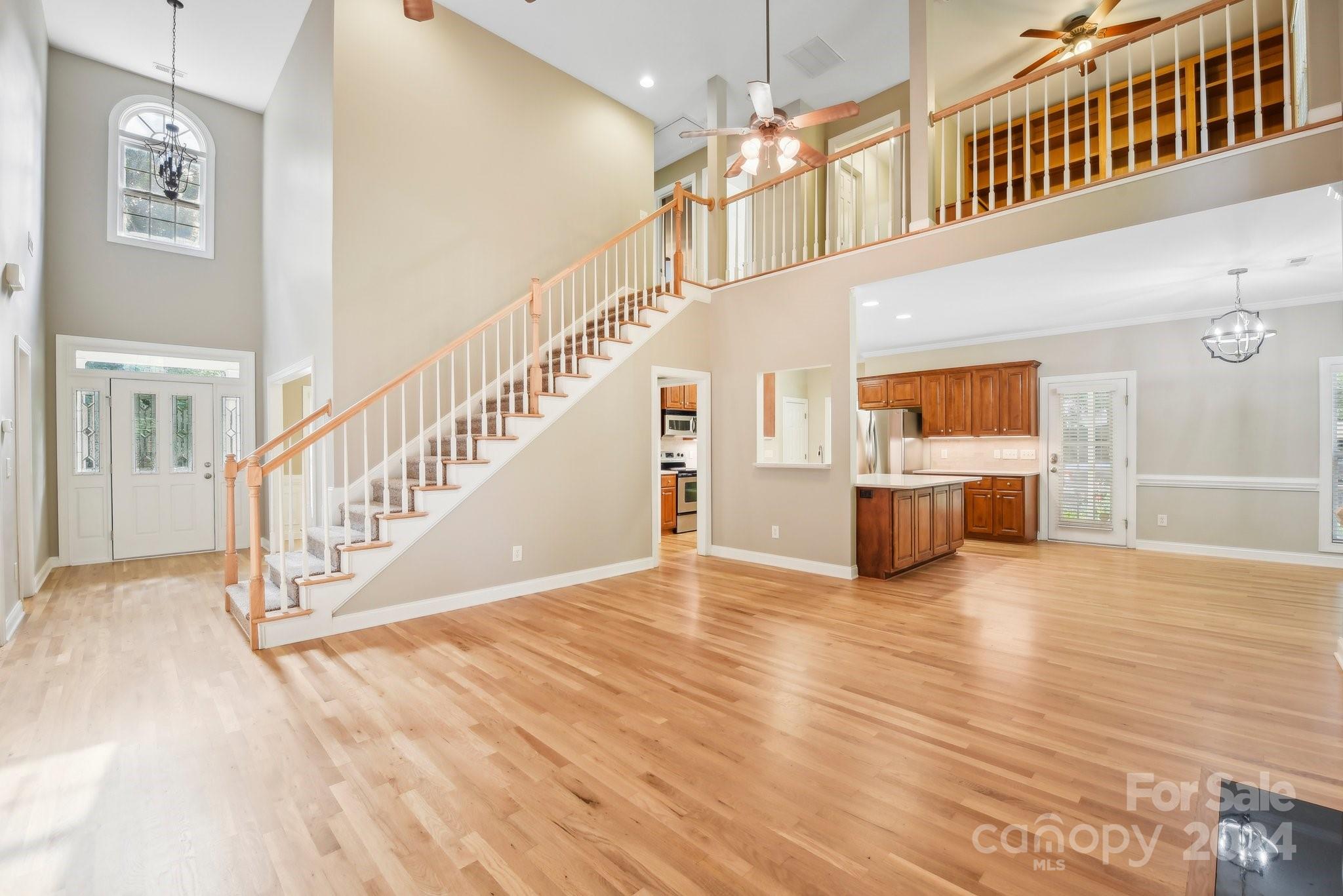 1013 Wesley Downs Road Monroe, NC 28110 - Photo 22 of 41 a view of an entryway with wooden floor