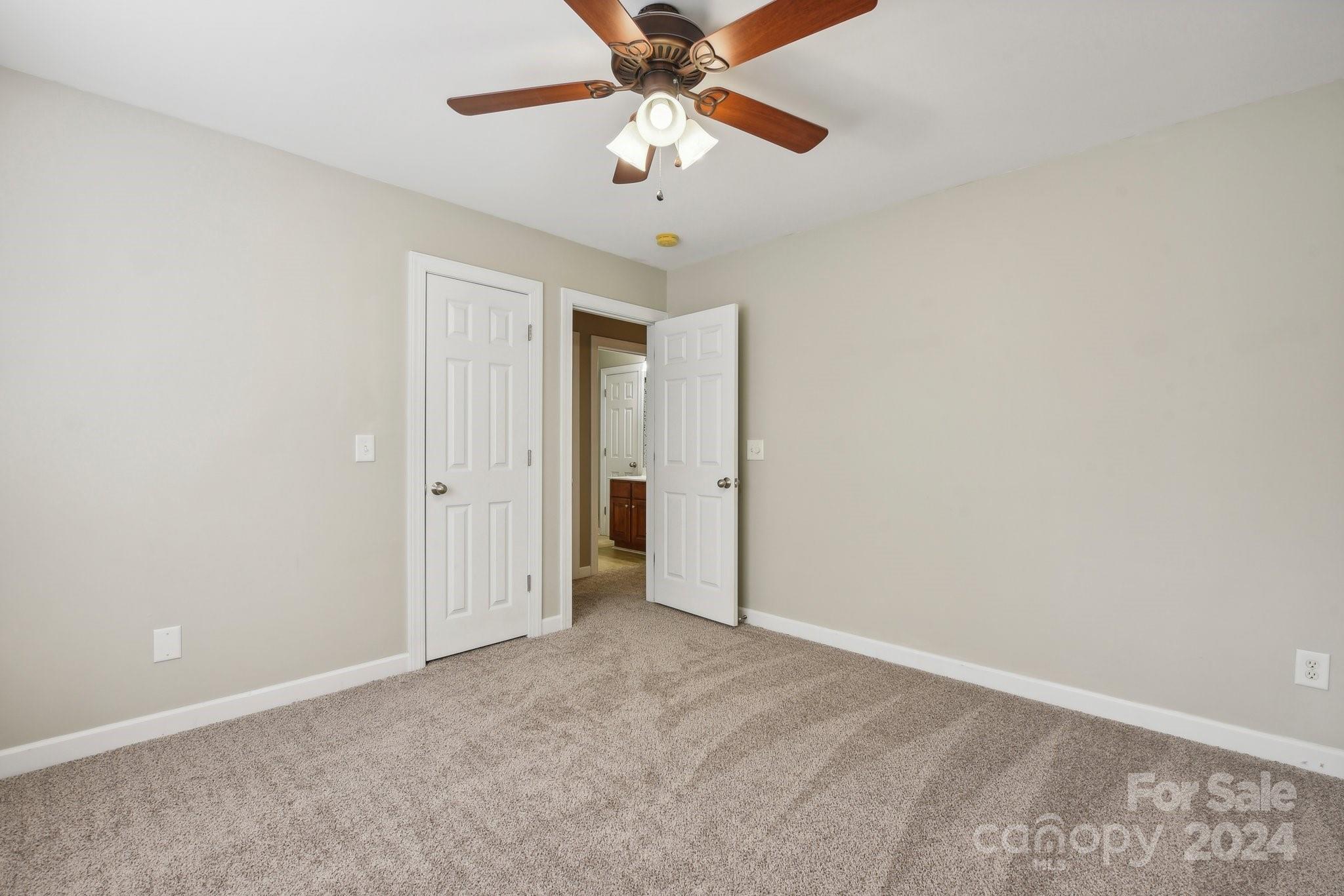 1013 Wesley Downs Road Monroe, NC 28110 - Photo 24 of 41 a view of a chandelier fan in a room
