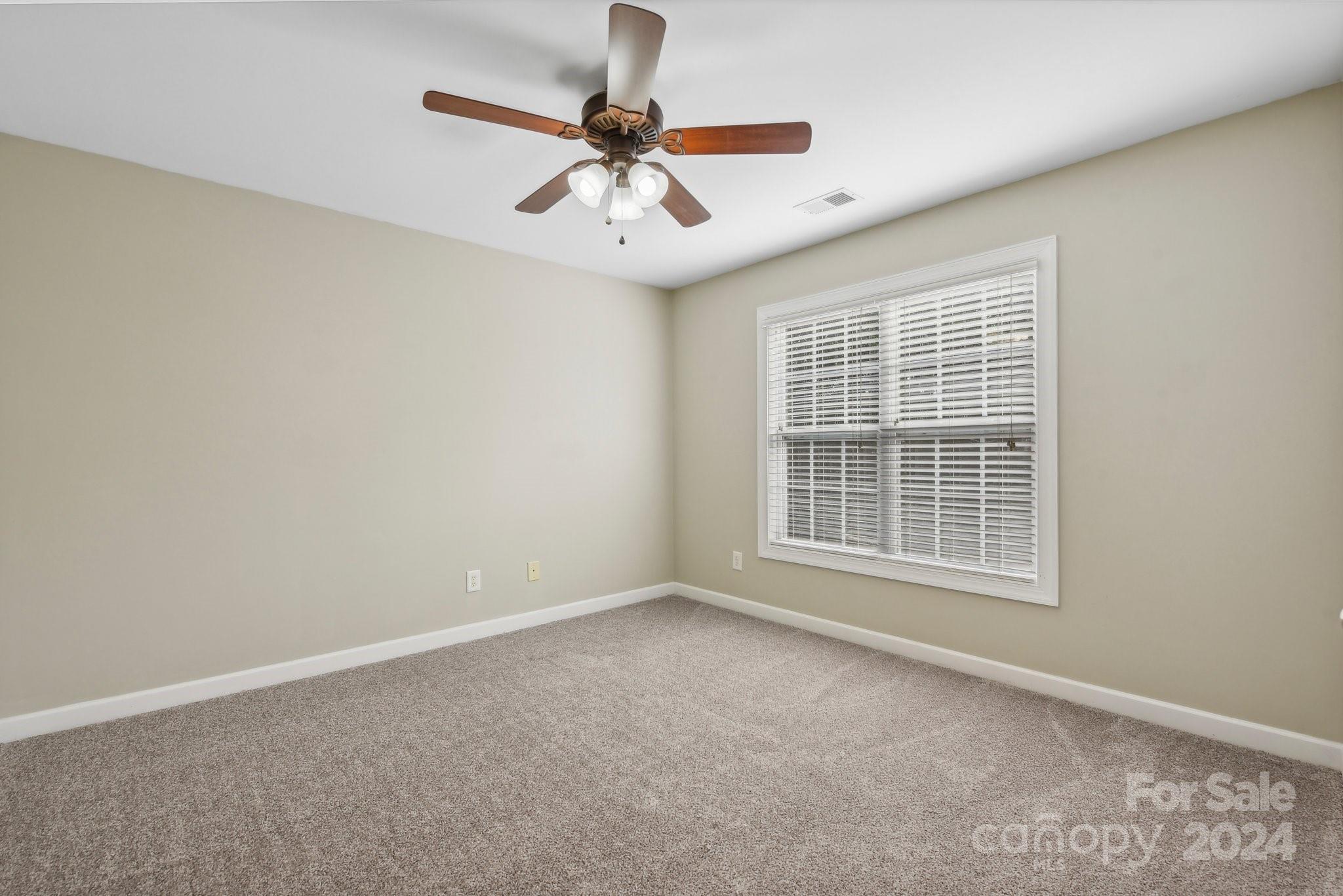 1013 Wesley Downs Road Monroe, NC 28110 - Photo 25 of 41 a view of an empty room with a window