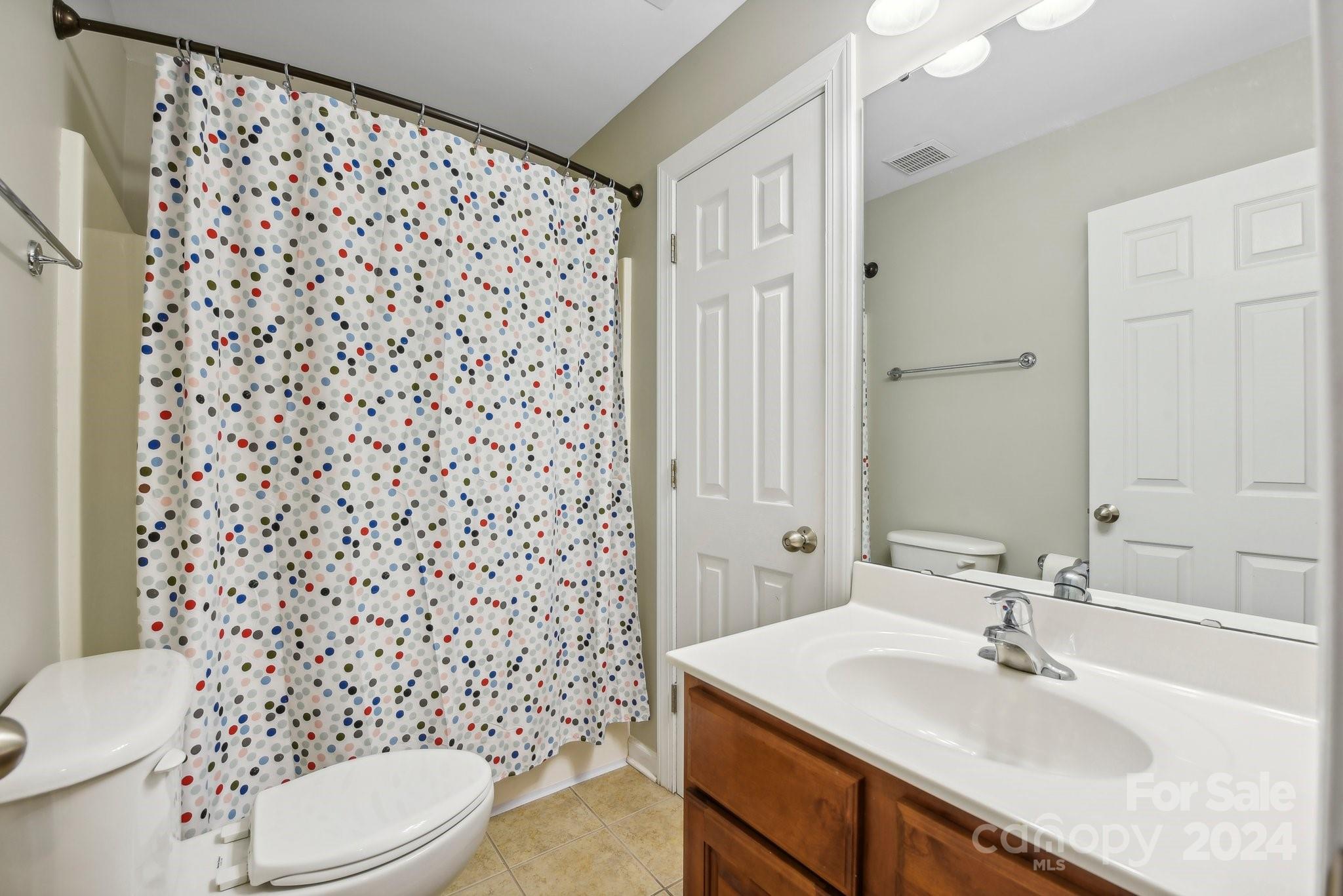 1013 Wesley Downs Road Monroe, NC 28110 - Photo 26 of 41 a bathroom with a sink toilet and shower